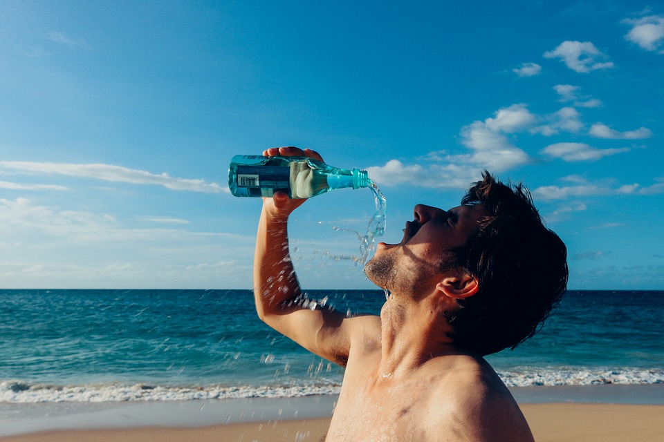 man taking water